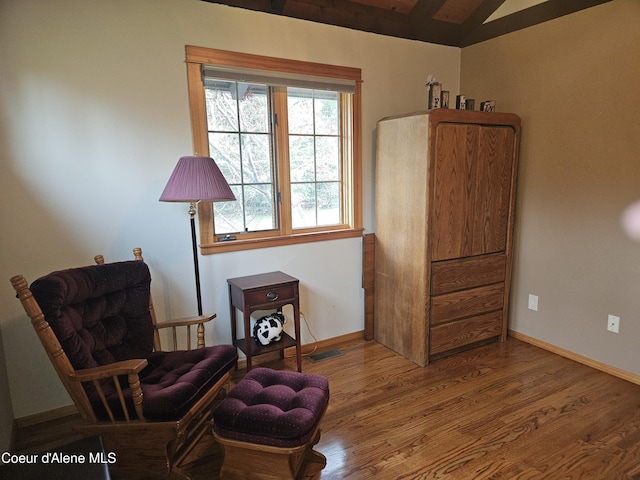 11268 N Friar Dr, Hayden, ID 83835 - living area with baseboards, wood finished floors, and vaulted ceiling with beams