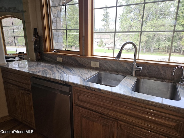 11268 N Friar Dr, Hayden, ID 83835 - kitchen with stone counters, stainless steel dishwasher, and a sink