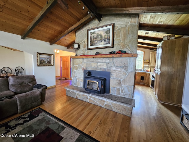 11268 N Friar Dr, Hayden, ID 83835 - living room featuring wooden ceiling, baseboards, wood finished floors, and vaulted ceiling with beams
