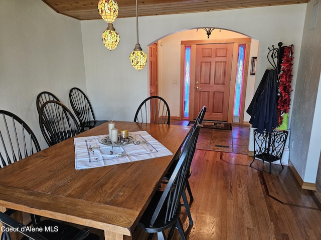 11268 N Friar Dr, Hayden, ID 83835 - dining area featuring arched walkways and wood finished floors