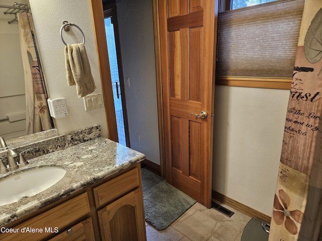 11268 N Friar Dr, Hayden, ID 83835 - full bath with visible vents, baseboards, vanity, and a textured wall