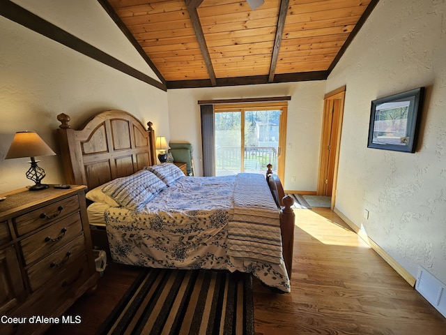 11268 N Friar Dr, Hayden, ID 83835 - bedroom with wood finished floors, vaulted ceiling with beams, wooden ceiling, access to outside, and visible vents