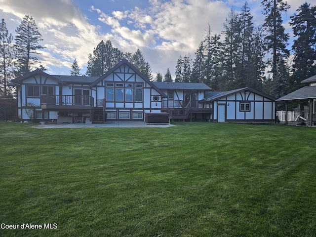 11268 N Friar Dr, Hayden, ID 83835 - rear view of house with an outdoor structure, stairs, a deck, and a patio