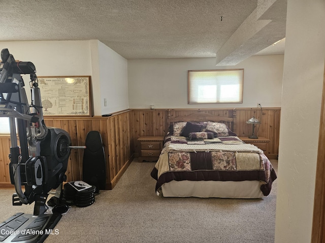 11268 N Friar Dr, Hayden, ID 83835 - bedroom featuring carpet floors, wood walls, a wainscoted wall, and a textured ceiling