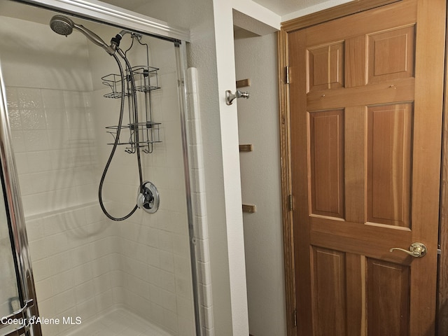 11268 N Friar Dr, Hayden, ID 83835 - bathroom with a textured wall and a shower stall