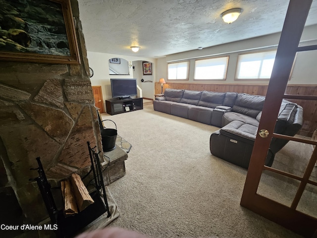 11268 N Friar Dr, Hayden, ID 83835 - carpeted living area featuring arched walkways and a textured ceiling