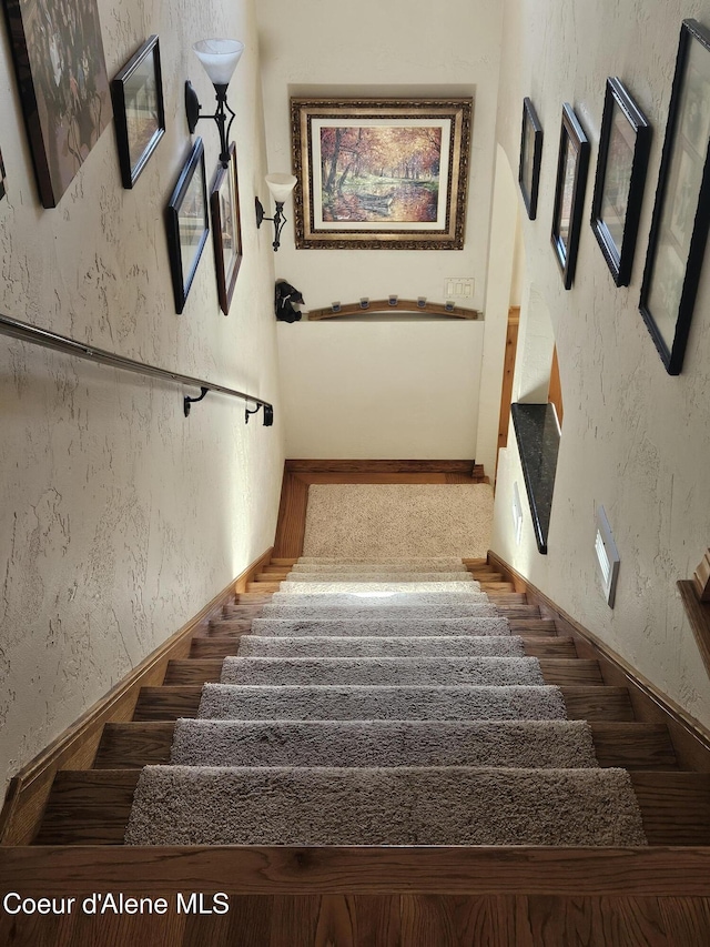 11268 N Friar Dr, Hayden, ID 83835 - stairway with a textured wall and wood finished floors
