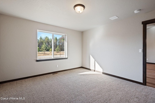 818 Sawbuck Rd, Spirit Lake, ID 83869 - unfurnished room featuring carpet floors, a smoke detector, and baseboards