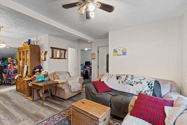 1515 E Elm Ave, Coeur Dalene, ID 83814 - living area with a textured ceiling, light wood-style flooring, and a ceiling fan