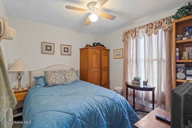 1515 E Elm Ave, Coeur Dalene, ID 83814 - bedroom with a textured ceiling and ceiling fan