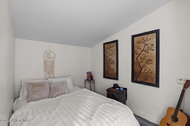 1515 E Elm Ave, Coeur Dalene, ID 83814 - bedroom with vaulted ceiling and baseboards