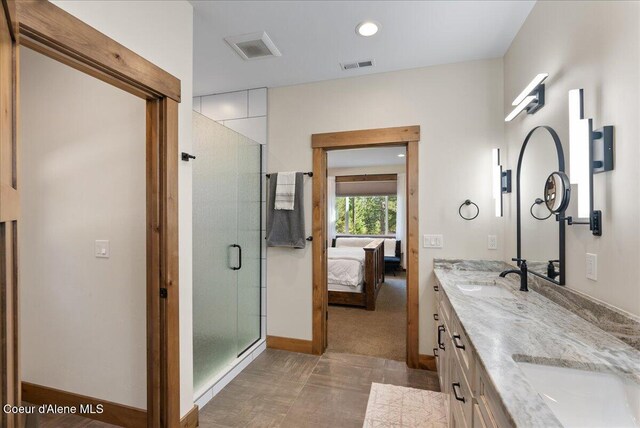 329 N Healing Dr, Blanchard, ID 83804 - ensuite bathroom with a sink, ensuite bathroom, a stall shower, double vanity, and visible vents