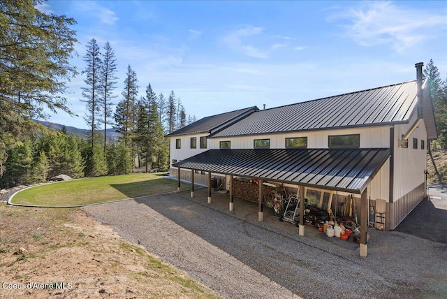 329 N Healing Dr, Blanchard, ID 83804 - back of house with a standing seam roof, a yard, and metal roof