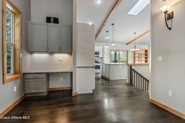 kitchen with baseboards, appliances with stainless steel finishes, gray cabinets, and dark wood-type flooring