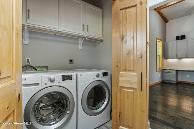 washroom with cabinet space, separate washer and dryer, and dark wood-style floors