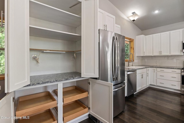 kitchen with a sink, appliances with stainless steel finishes, and white cabinets
