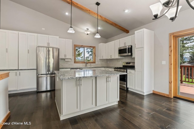 kitchen featuring a sink, appliances with stainless steel finishes, white cabinets, and tasteful backsplash