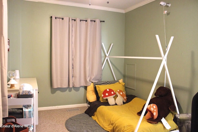 bedroom featuring baseboards, ornamental molding, and carpet floors