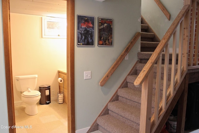 staircase with tile patterned floors