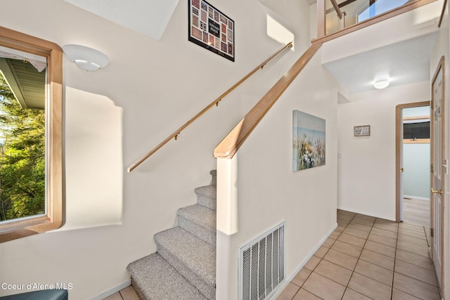 3338 Bottle Bay Rd, Sagle, ID 83860 - stairs with visible vents, baseboards, and tile patterned floors