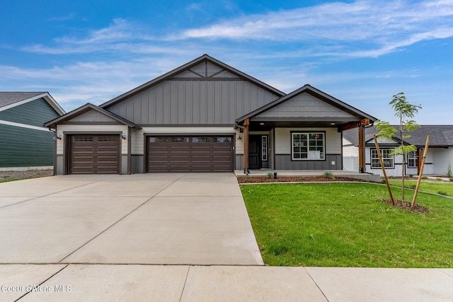 craftsman inspired home featuring an attached garage, a porch, driveway, and a front yard