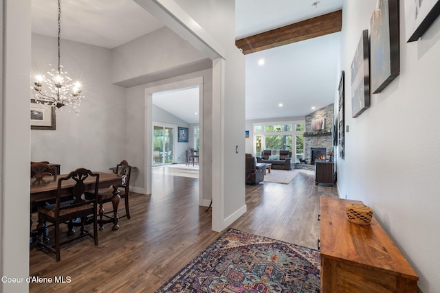 5867 W Sparrowhawk Dr, Rathdrum, ID 83858 - entrance foyer with a stone fireplace, an inviting chandelier, and wood finished floors