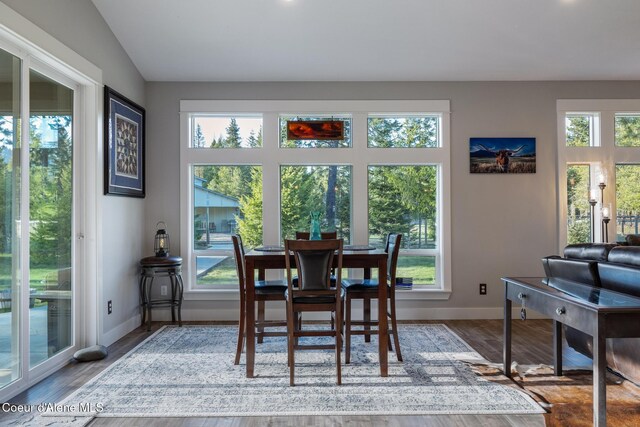 5867 W Sparrowhawk Dr, Rathdrum, ID 83858 - dining area featuring wood finished floors, baseboards, and a healthy amount of sunlight