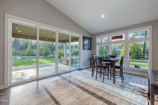 5867 W Sparrowhawk Dr, Rathdrum, ID 83858 - dining room featuring vaulted ceiling, baseboards, and wood finished floors