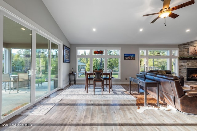 5867 W Sparrowhawk Dr, Rathdrum, ID 83858 - interior space with recessed lighting, lofted ceiling, a healthy amount of sunlight, and a stone fireplace