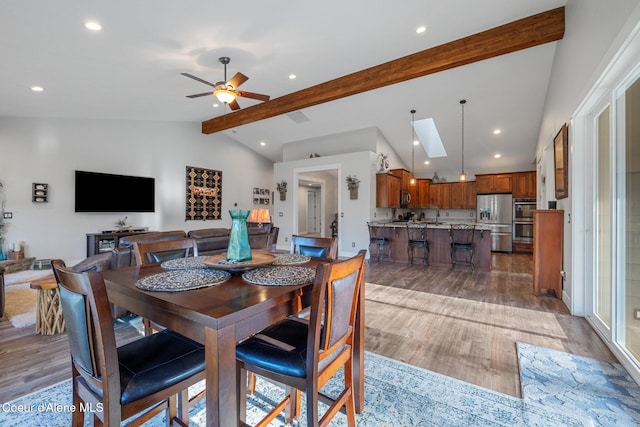 5867 W Sparrowhawk Dr, Rathdrum, ID 83858 - dining room with lofted ceiling with beams, a ceiling fan, light wood-style floors, and recessed lighting