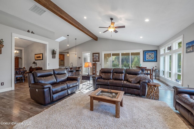 5867 W Sparrowhawk Dr, Rathdrum, ID 83858 - living room featuring lofted ceiling with beams, baseboards, visible vents, wood finished floors, and ceiling fan
