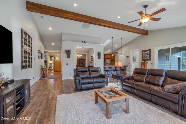 5867 W Sparrowhawk Dr, Rathdrum, ID 83858 - living area with vaulted ceiling with beams, visible vents, recessed lighting, a ceiling fan, and wood finished floors