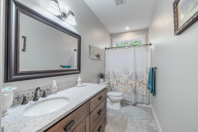5867 W Sparrowhawk Dr, Rathdrum, ID 83858 - bathroom featuring curtained shower, visible vents, toilet, vanity, and baseboards