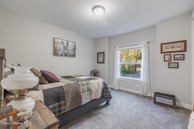 5867 W Sparrowhawk Dr, Rathdrum, ID 83858 - bedroom featuring baseboards and carpet flooring
