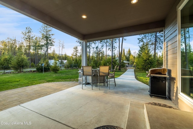 5867 W Sparrowhawk Dr, Rathdrum, ID 83858 - view of patio with a fenced backyard, outdoor dining space, and area for grilling