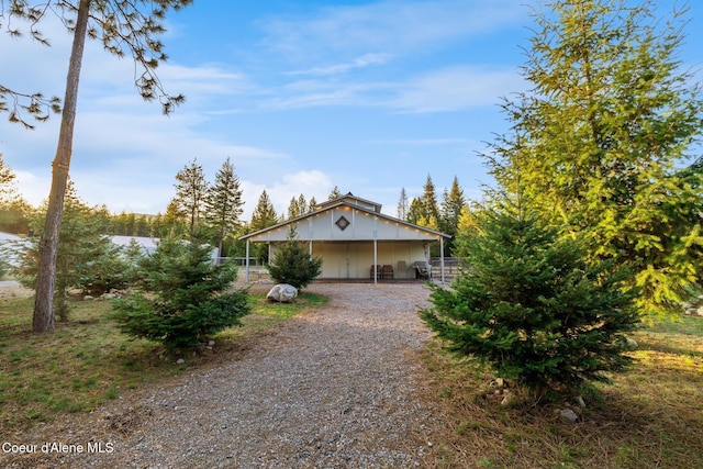 5867 W Sparrowhawk Dr, Rathdrum, ID 83858 - view of front facade featuring an outdoor structure and fence