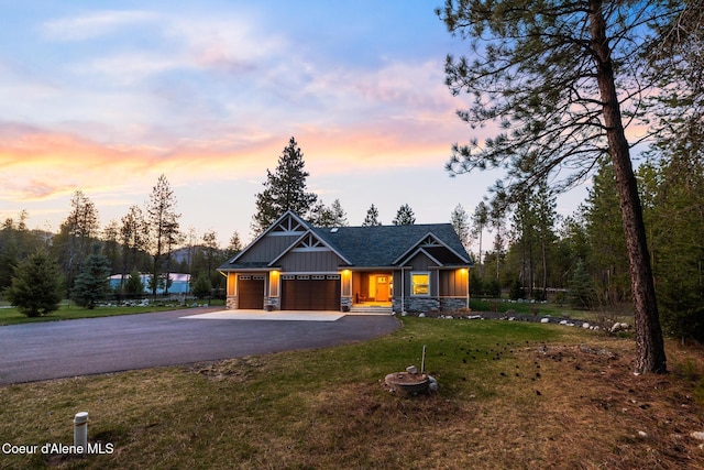 5867 W Sparrowhawk Dr, Rathdrum, ID 83858 - craftsman inspired home with board and batten siding, stone siding, driveway, and a front yard