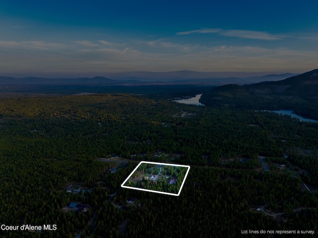 5867 W Sparrowhawk Dr, Rathdrum, ID 83858 - aerial view at dusk with a mountain view