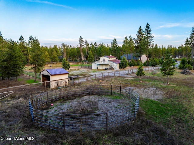 5867 W Sparrowhawk Dr, Rathdrum, ID 83858 - view of yard with an exterior structure, an outdoor structure, and a rural view