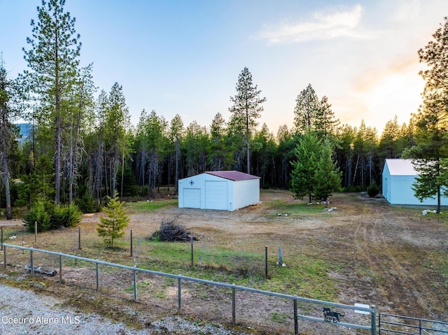 5867 W Sparrowhawk Dr, Rathdrum, ID 83858 - view of yard with an outdoor structure and fence