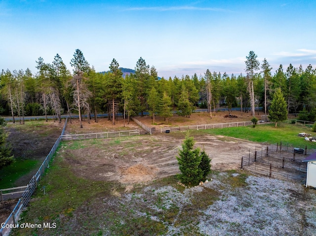 5867 W Sparrowhawk Dr, Rathdrum, ID 83858 - view of yard featuring fence, a rural view, and an enclosed area