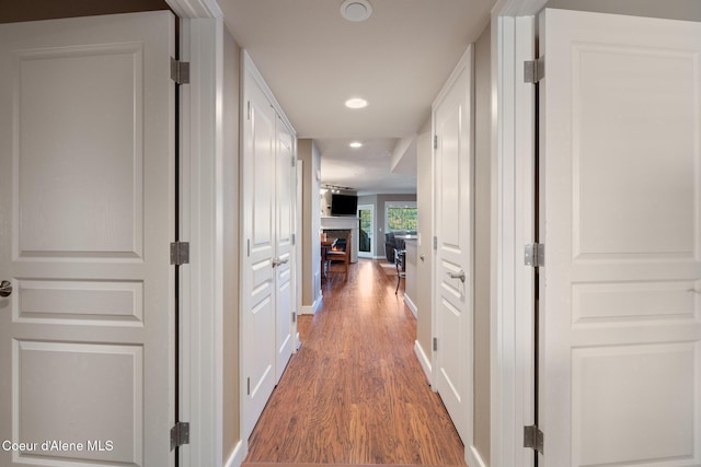 4549 S Arrow Point Dr # 207, Harrison, ID 83833 - hall with baseboards, light wood-style floors, and recessed lighting