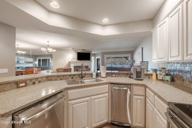 4549 S Arrow Point Dr # 207, Harrison, ID 83833 - kitchen with a sink, open floor plan, an inviting chandelier, appliances with stainless steel finishes, and recessed lighting