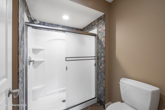 4549 S Arrow Point Dr # 207, Harrison, ID 83833 - bathroom featuring a shower stall and toilet