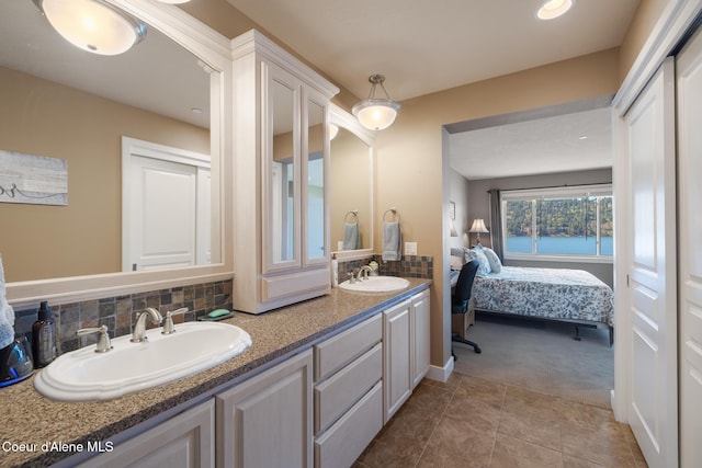 4549 S Arrow Point Dr # 207, Harrison, ID 83833 - ensuite bathroom featuring ensuite bath, tasteful backsplash, a sink, and double vanity