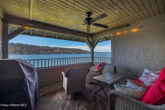 4549 S Arrow Point Dr # 207, Harrison, ID 83833 - view of patio / terrace with a ceiling fan, a balcony, area for grilling, and a water view
