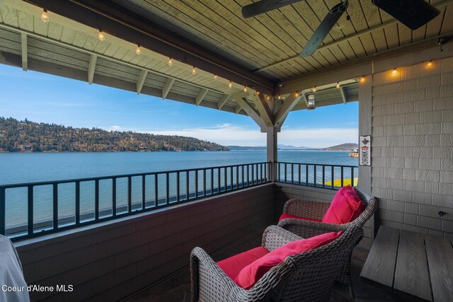 4549 S Arrow Point Dr # 207, Harrison, ID 83833 - balcony featuring a ceiling fan and a water view