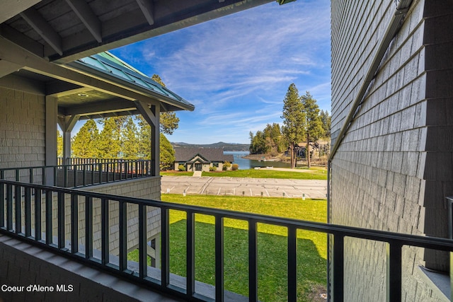 4549 S Arrow Point Dr # 207, Harrison, ID 83833 - balcony featuring a porch and a water and mountain view