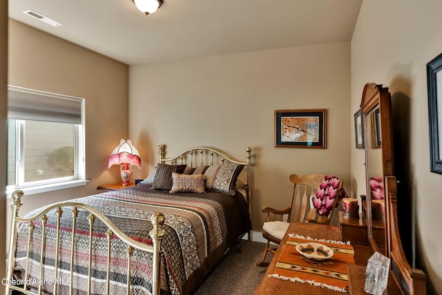 bedroom featuring visible vents and carpet flooring