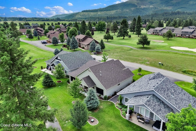 drone / aerial view featuring a residential view and a mountain view
